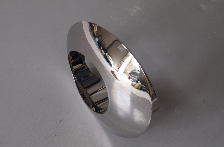 Prasto, Small stainless steel sculpture with a hole©, 2011; Stainless steel, lead, 45x30x10 cm