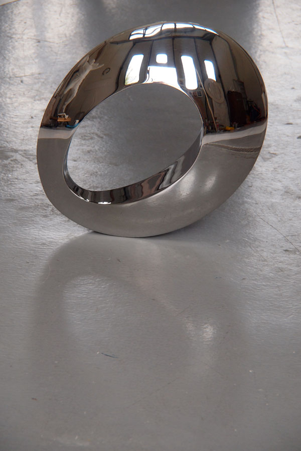 Prasto, Small stainless steel sculpture with a hole©, 2011; Stainless steel, lead, 45x30x10 cm