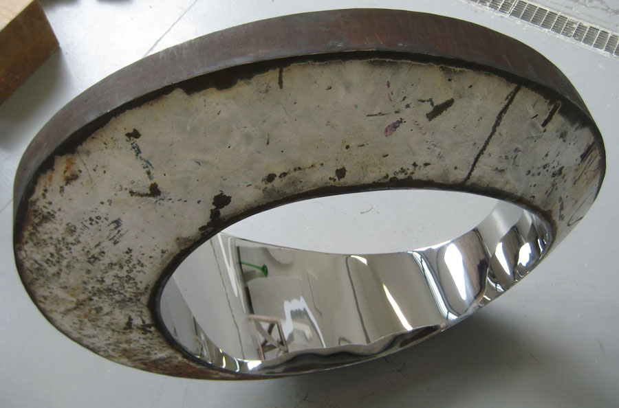 Prasto, White rusted egg form sculpture©, 2010; Rusted iron, stainless steel, lead, 100x80x35 cm